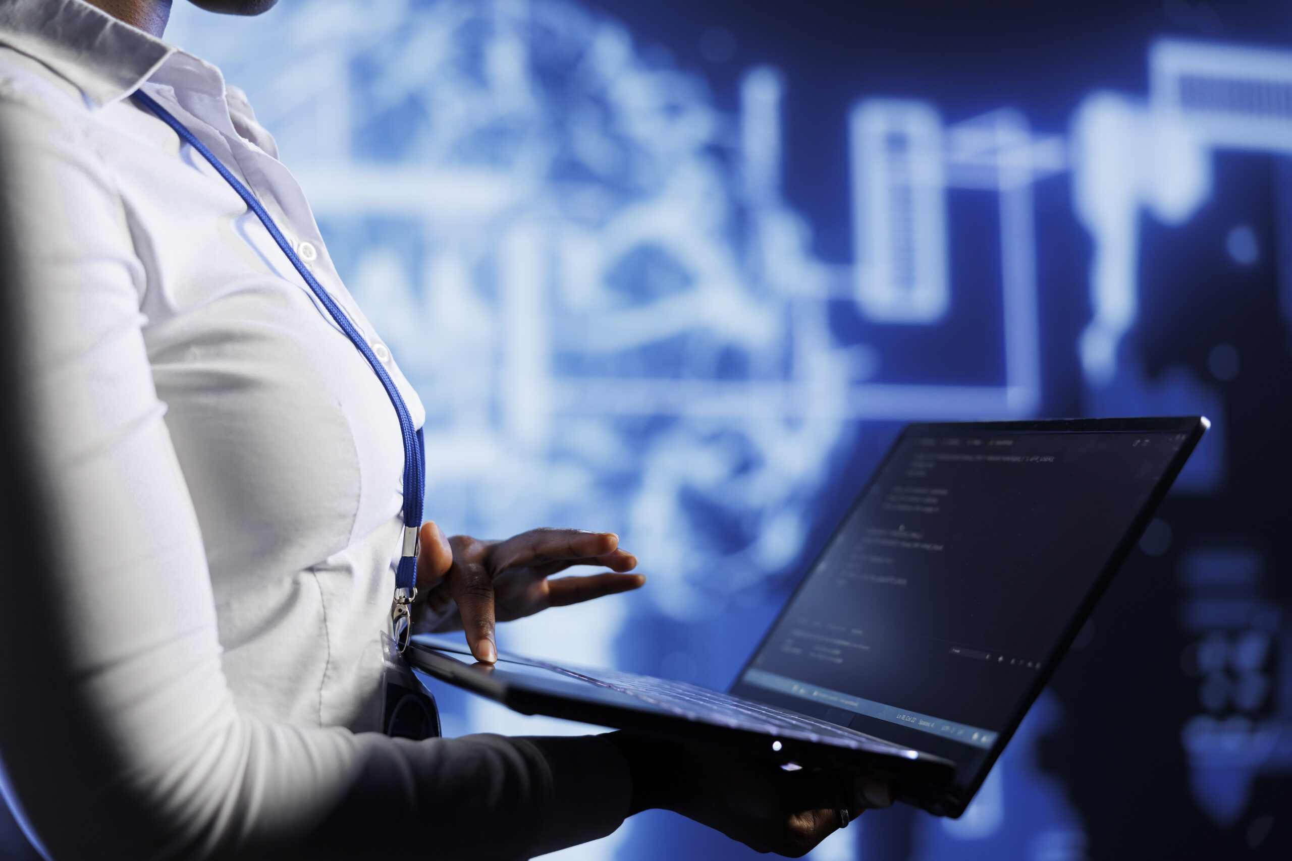 Admin uses laptop to develop technologically advanced artificial intelligence neural networks nodes modeled after human brain. Worker setting up AI machine learning for pattern recognition
